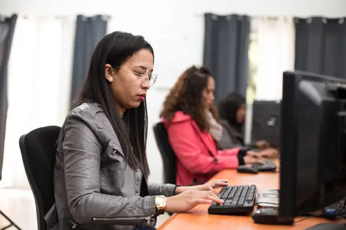 Woman typing on a computer